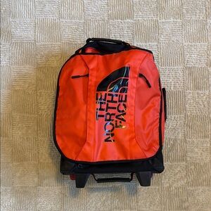 The North Face Orange Rolling Carry On Bag
